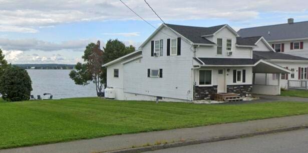 view of front of house featuring a water view and a front yard