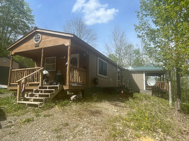 rear view of house with a porch