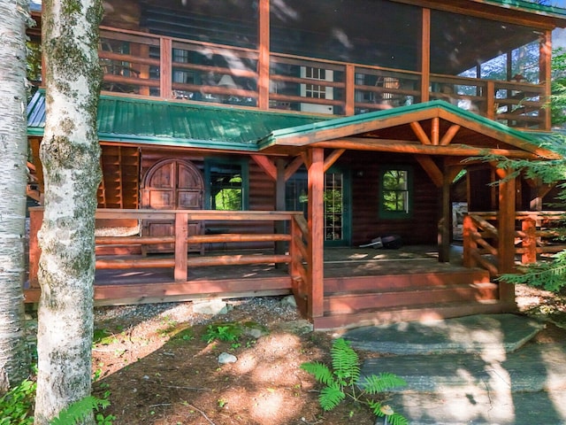 rear view of house with metal roof