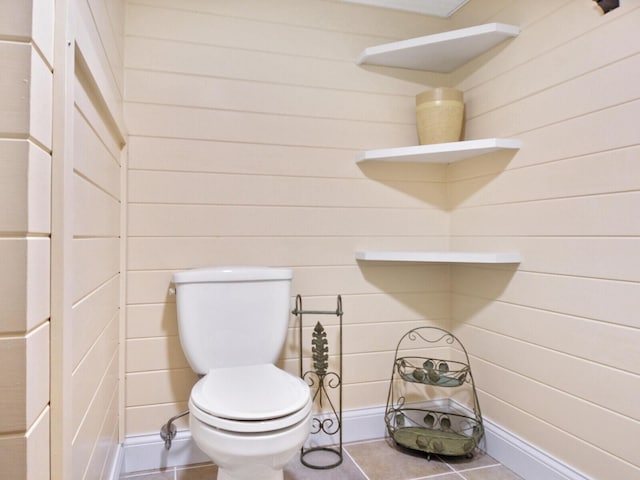 bathroom with tile patterned flooring and toilet