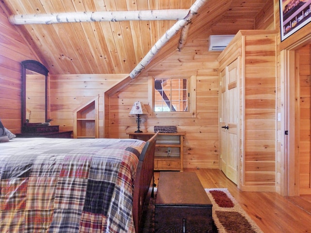bedroom featuring vaulted ceiling, wood walls, wood finished floors, and wood ceiling