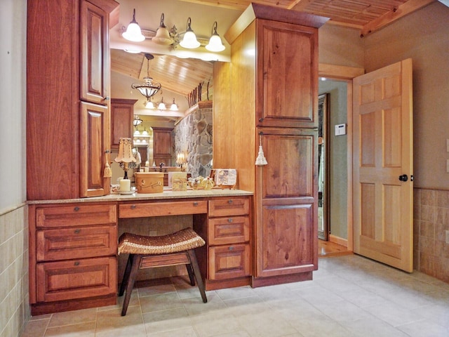 bathroom featuring wood ceiling, vaulted ceiling, tile walls, and vanity