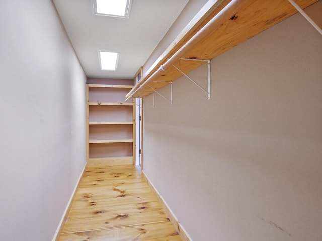 walk in closet featuring light wood-style floors