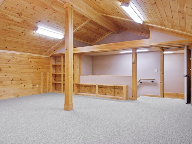 additional living space featuring lofted ceiling, wood walls, carpet, and wood ceiling