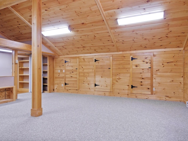 additional living space featuring lofted ceiling, carpet floors, wood walls, and wood ceiling