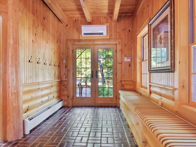 doorway with brick floor, a baseboard radiator, french doors, beam ceiling, and a wall mounted air conditioner