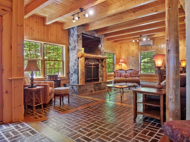 interior space with a stone fireplace, wooden ceiling, brick floor, wood walls, and a wall mounted AC