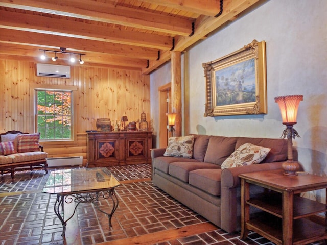 living area with brick floor, a baseboard radiator, wood walls, an AC wall unit, and beamed ceiling