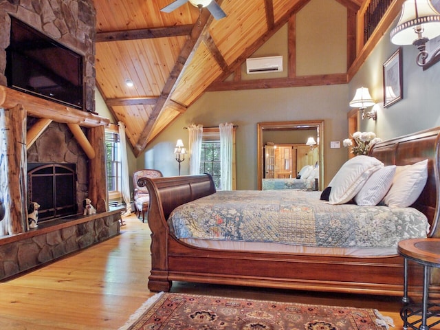 bedroom featuring vaulted ceiling with beams, a fireplace, wood ceiling, wood finished floors, and a wall mounted air conditioner