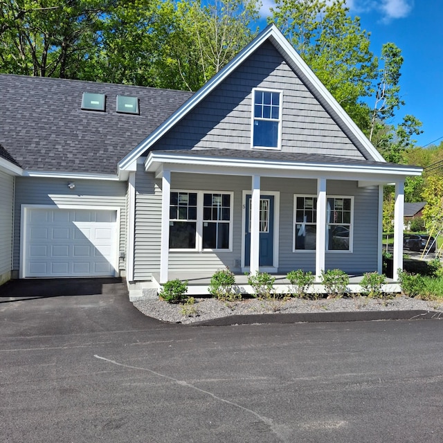 5 Apex Dr Unit 1, Westbrook, ME 04092 - view of front of house with a shingled roof, an attached garage, a porch, and driveway