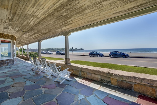 view of patio / terrace with a water view