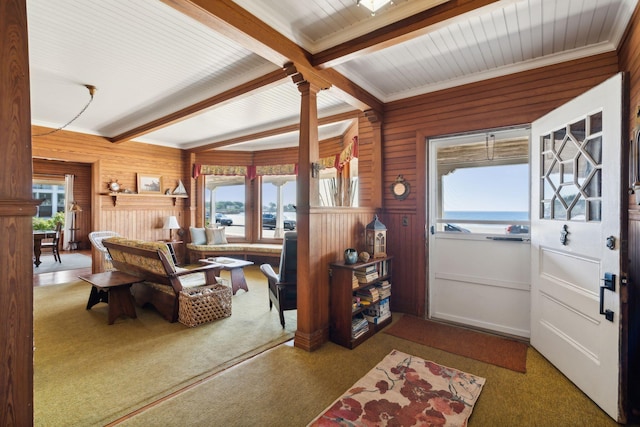 93 Beach Ave, Kennebunk, ME 04043 - carpeted entryway featuring beam ceiling, wood walls, and ornamental molding