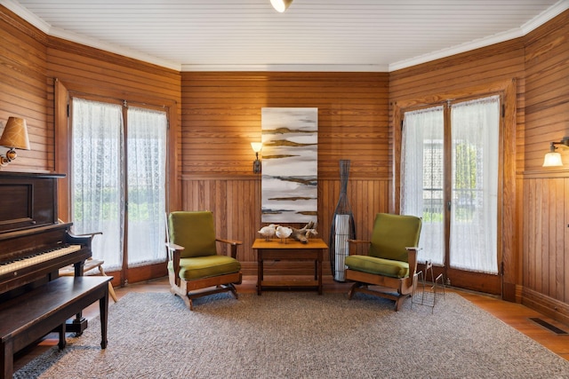 93 Beach Ave, Kennebunk, ME 04043 - living area with wood walls, wood finished floors, and crown molding