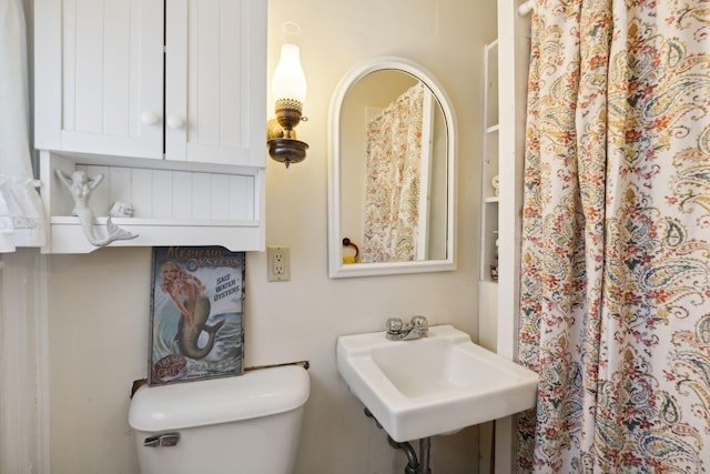 bathroom with toilet and sink