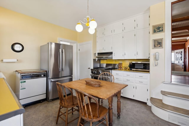 93 Beach Ave, Kennebunk, ME 04043 - kitchen with appliances with stainless steel finishes, under cabinet range hood, white cabinets, and a chandelier