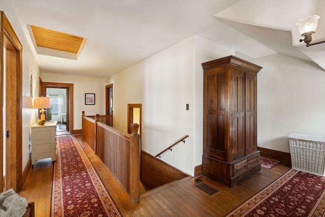 corridor featuring dark wood-type flooring