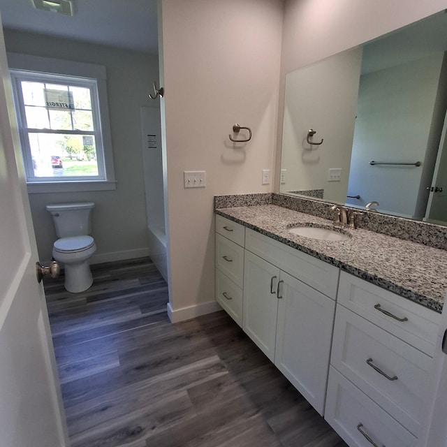7 Apex Dr Unit 2, Westbrook, ME 04092 - bathroom featuring vanity, toilet, wood finished floors, shower / bathtub combination, and baseboards