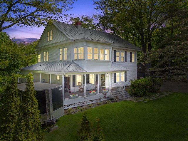 view of front of property with a yard