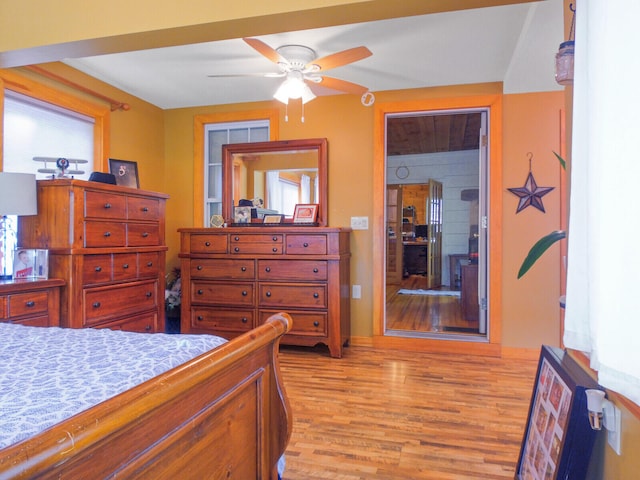 bedroom with light wood-type flooring and ceiling fan