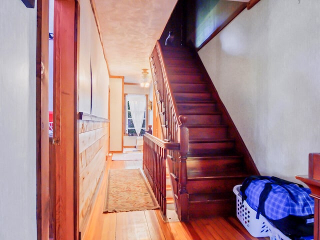 stairway featuring light wood-type flooring