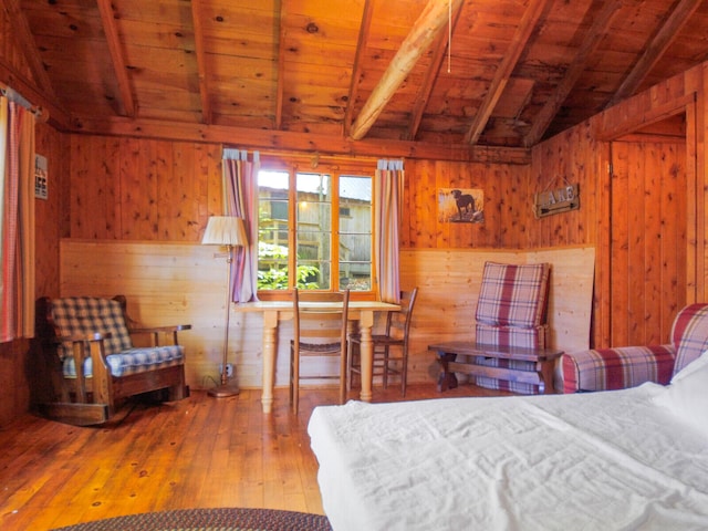 bedroom featuring wooden ceiling, lofted ceiling with beams, wooden walls, and hardwood / wood-style floors