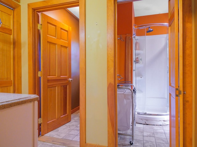 corridor featuring light tile floors