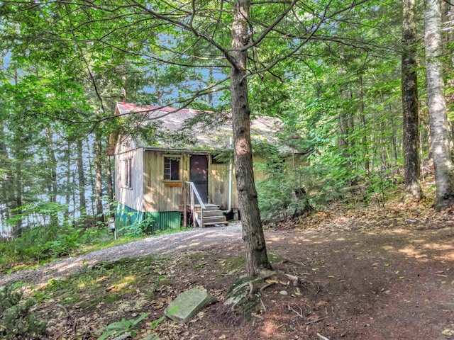 view of property hidden behind natural elements