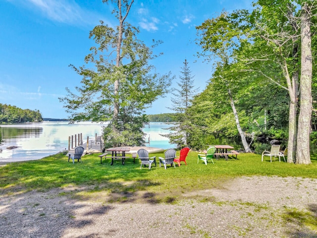 view of yard featuring an outdoor fire pit and a water view