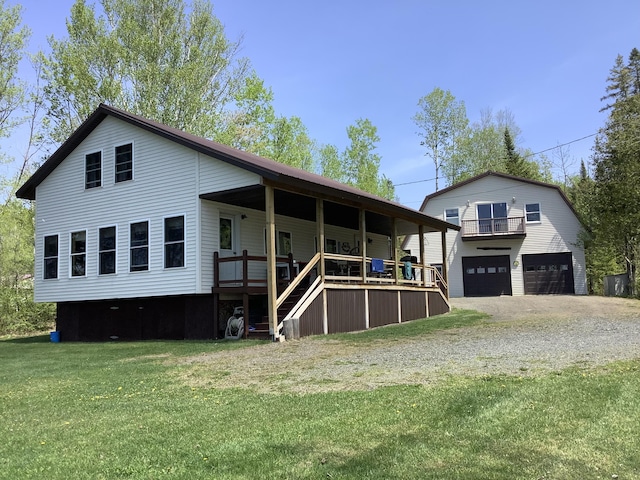 13 Goss Brook Ln, Winterville Plt, ME 04739 - rear view of house with a lawn, a porch, and a garage