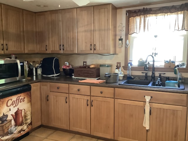 kitchen with light tile patterned flooring and sink