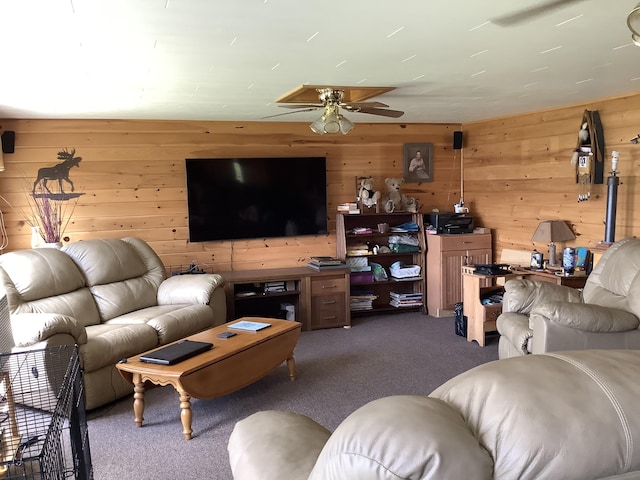 living room featuring dark carpet, ceiling fan, and wooden walls