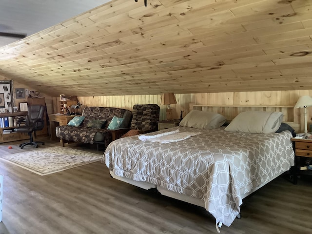 bedroom with dark hardwood / wood-style floors, wooden walls, wooden ceiling, and vaulted ceiling