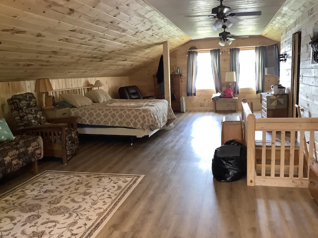 bedroom with wood-type flooring, wooden ceiling, ceiling fan, and lofted ceiling