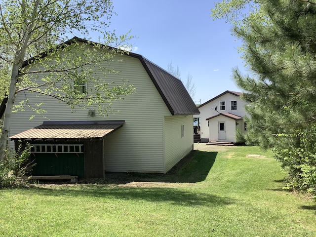 rear view of property featuring a yard