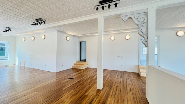 unfurnished room featuring hardwood / wood-style flooring