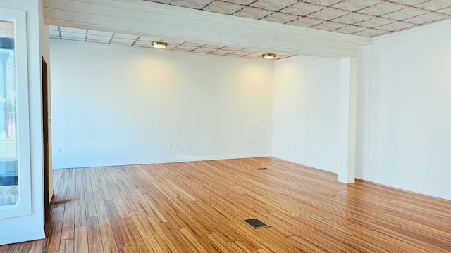 spare room featuring light hardwood / wood-style floors