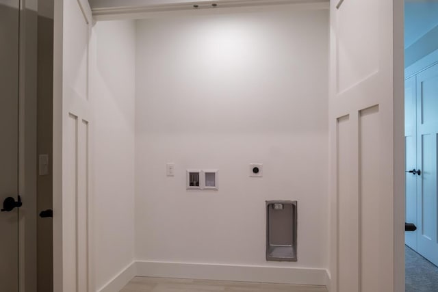 laundry area featuring laundry area, hookup for an electric dryer, baseboards, and washer hookup