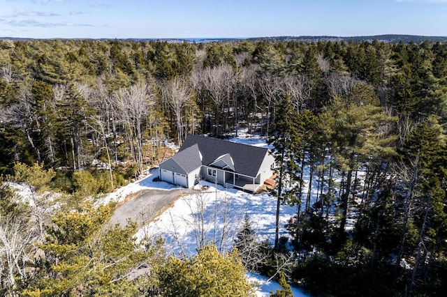 aerial view featuring a wooded view