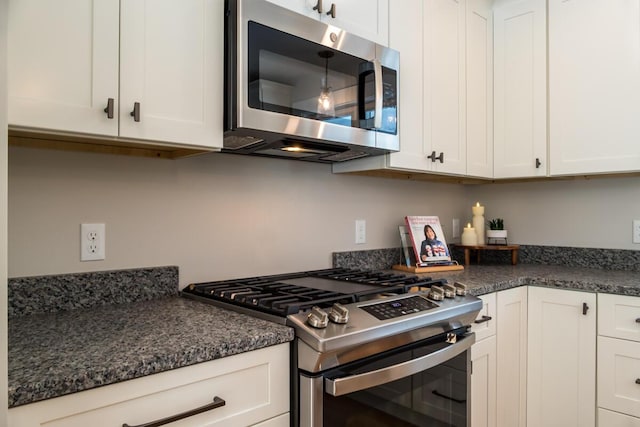 kitchen featuring white cabinetry and appliances with stainless steel finishes