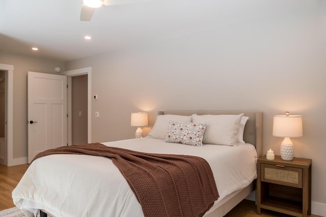 bedroom with recessed lighting and light wood-style flooring