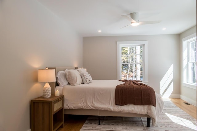 bedroom with recessed lighting, baseboards, a ceiling fan, and wood finished floors