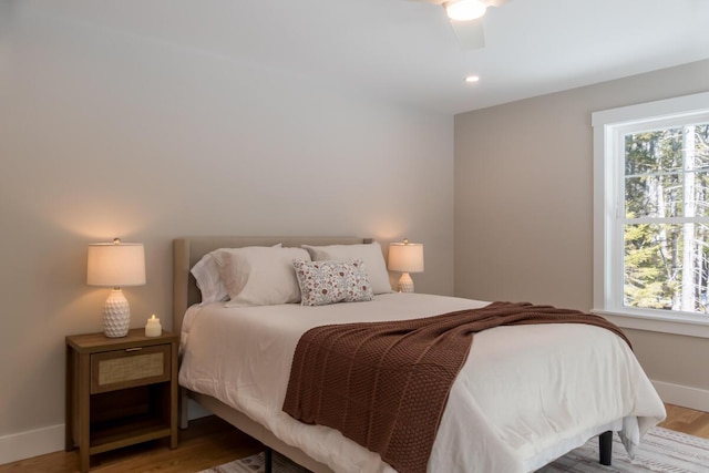 bedroom with a ceiling fan, light wood-style flooring, recessed lighting, and baseboards