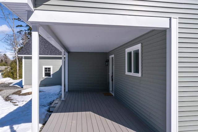 view of snow covered deck