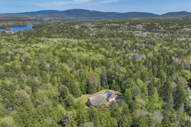 aerial view with a view of trees and a water and mountain view