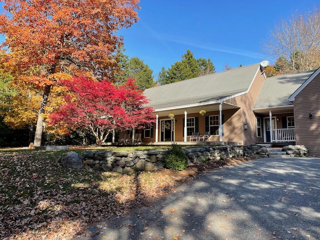 back of property featuring a porch