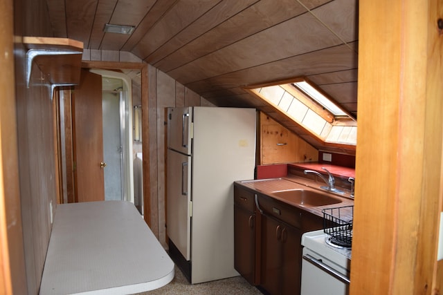 kitchen with white refrigerator, range, lofted ceiling with skylight, sink, and wooden ceiling