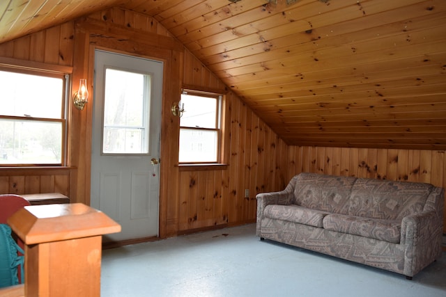 living room with wooden walls, lofted ceiling, and wood ceiling