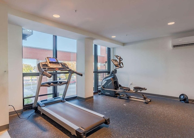 387 Commercial St Unit 709, Portland, ME 04101 - workout room with a wall mounted AC, plenty of natural light, baseboards, and recessed lighting