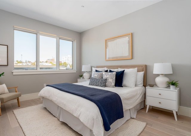 387 Commercial St Unit 709, Portland, ME 04101 - bedroom featuring light wood-style floors and baseboards