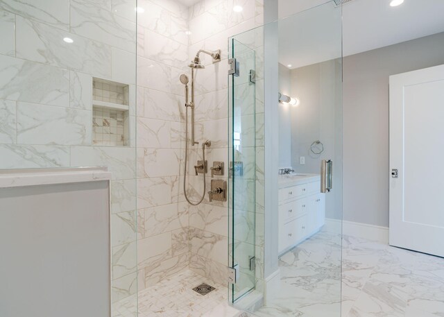 387 Commercial St Unit 709, Portland, ME 04101 - bathroom with a walk in shower, marble tiled floors, vanity, and recessed lighting